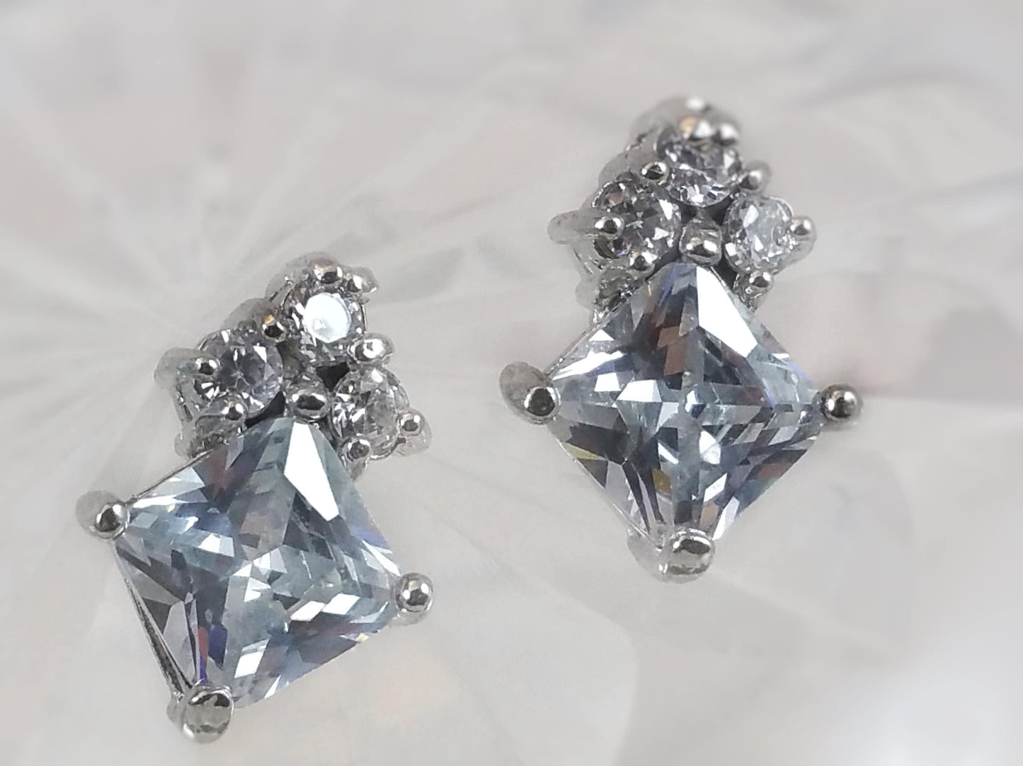 7mm princess cut with three stone stud earrings, April birthstone