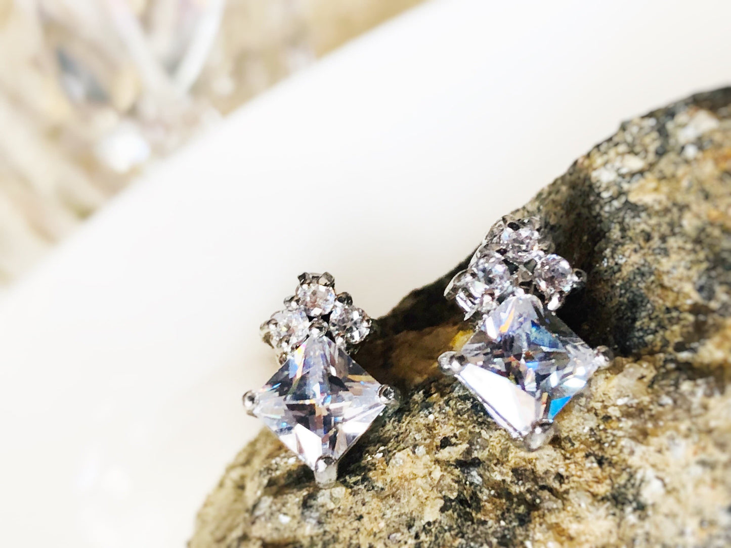 7mm princess cut with three stone stud earrings, April birthstone